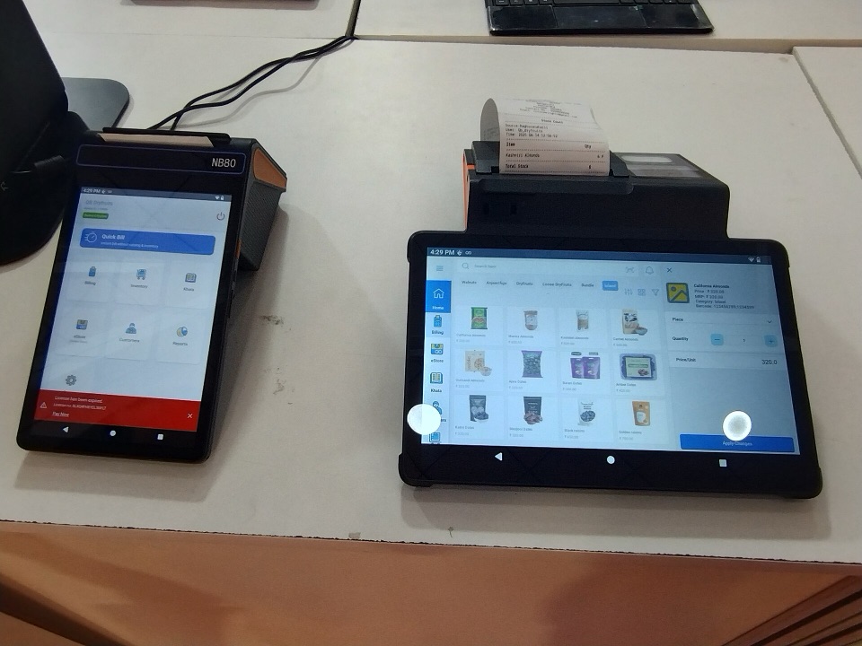 Dua perangkat POS Android di meja kasir lengkap dengan printer struk